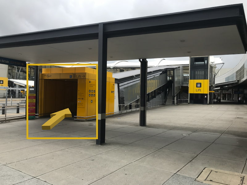 Yellow arrow indicating to use the lift to access the Skywalk